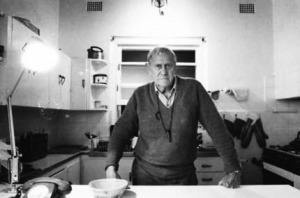 Patrick White, presumably in his kitchen. Picture reproduced by The Age in 2006; photographer unacknowledged in this version online.